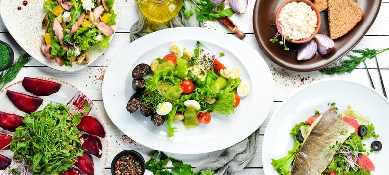 [freepicdownloader.com]-food-set-salads-dishes-white-wooden-background-top-view-free-space-your-text-rustic-style-medium.jpg